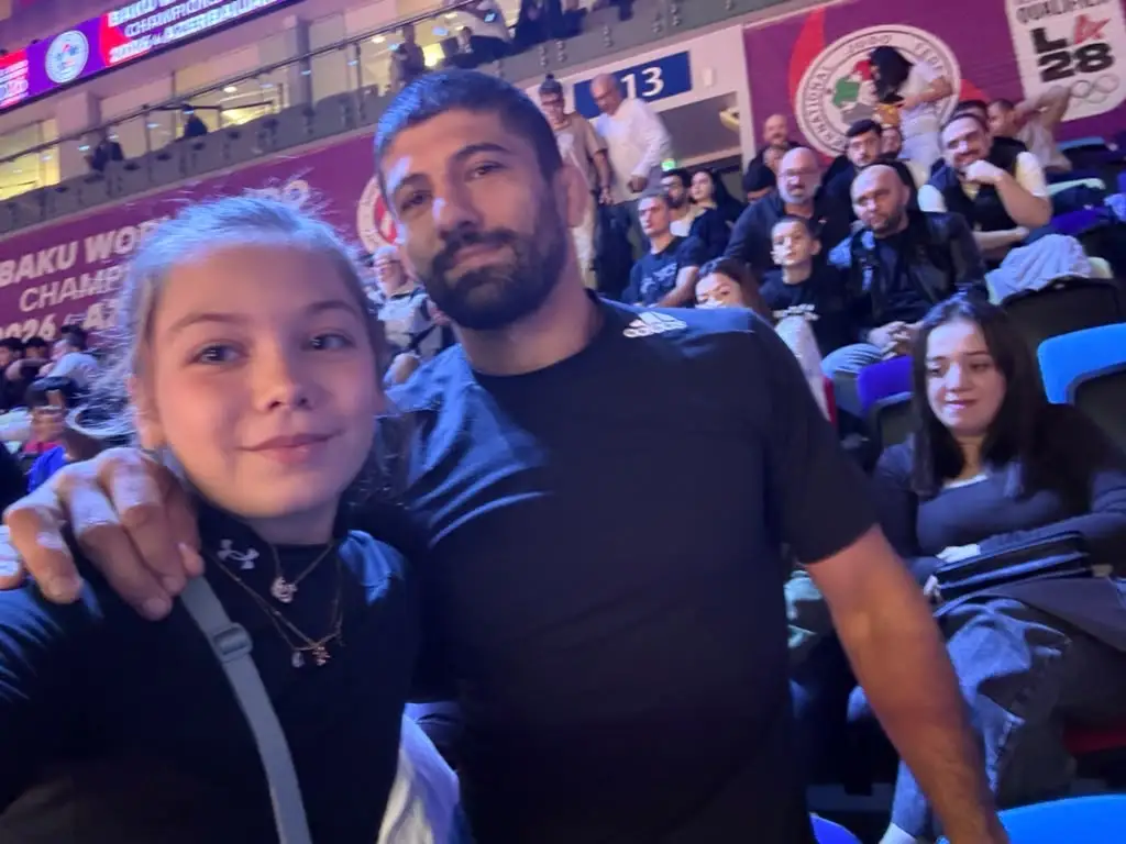 Melissa and a man in a selfie in the stands
